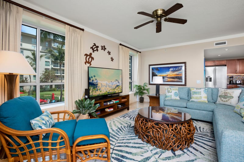 Living room flows into paradise with wall-to-wall glass sliders