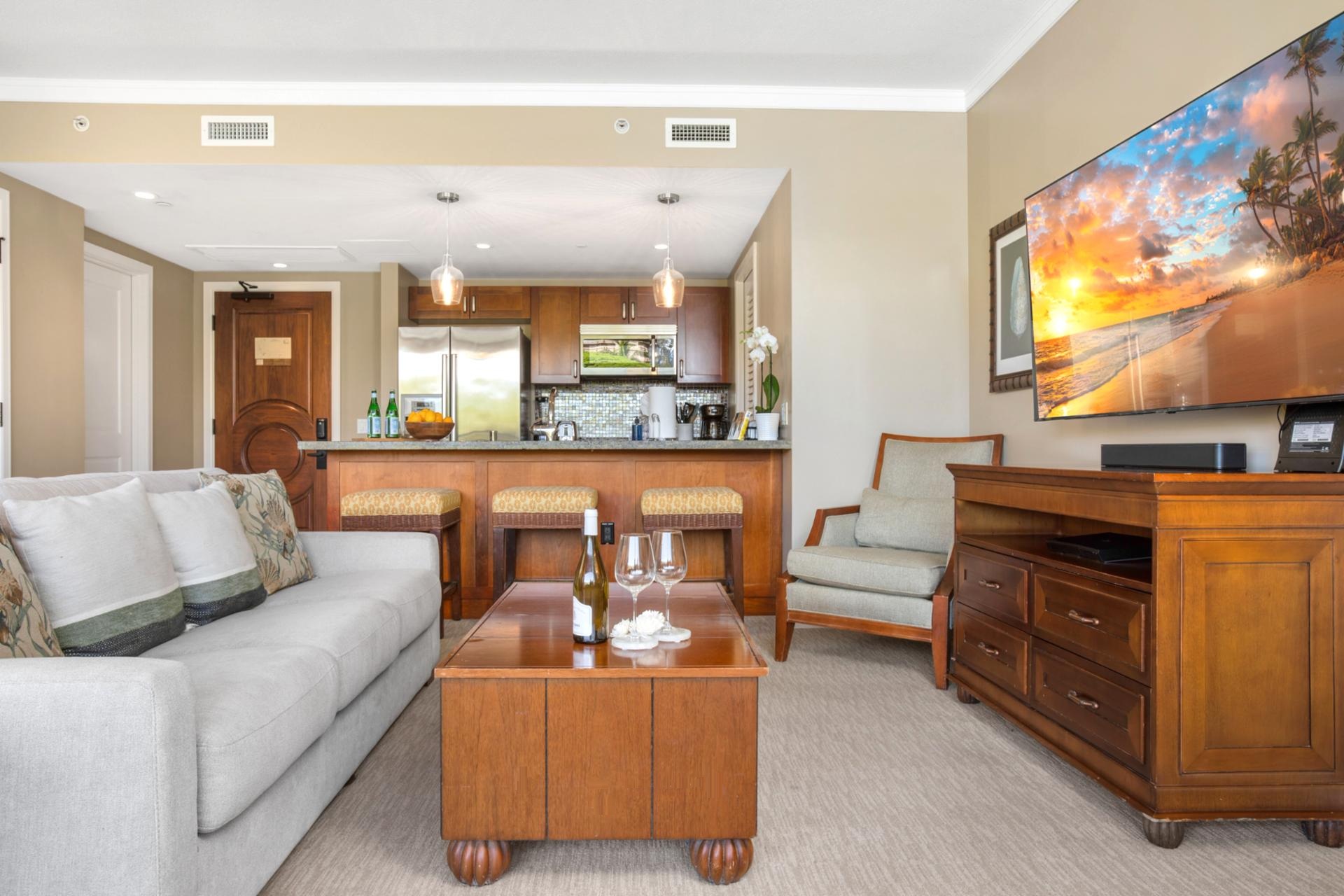 Relax in this bright island suite with modern kitchen, plush sofa, HDTV & tropical-inspired décor touches