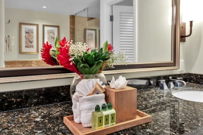 Elegant guest bath with fresh island touches and L'Occitane bath amenities