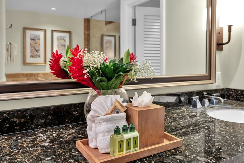 Elegant guest bath with fresh island touches and L'Occitane bath amenities