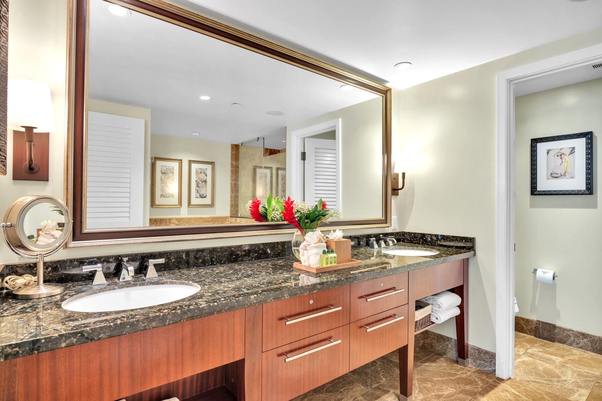 Modern guest bath featuring a granite double vanity