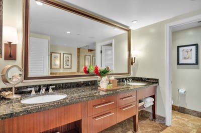 Modern guest bath featuring a granite double vanity