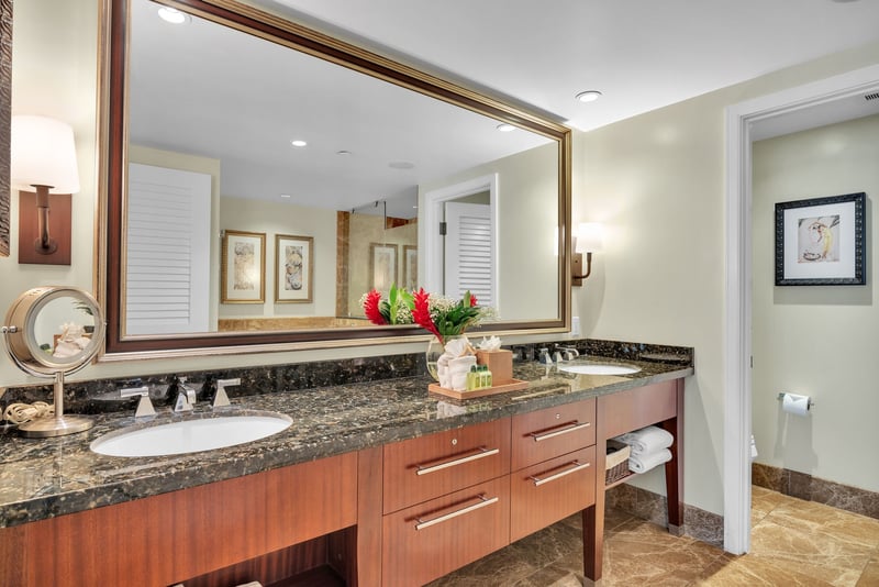 Modern guest bath featuring a granite double vanity