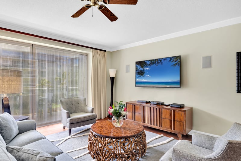 Comfortable living space with natural light and tropical charm