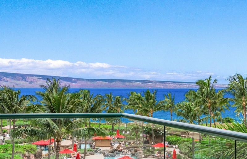 Unobstructed ocean views framed by lush palms—your Hawaiian escape starts here.
