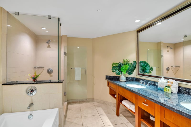 The master bath features a double vanity and soaking tub