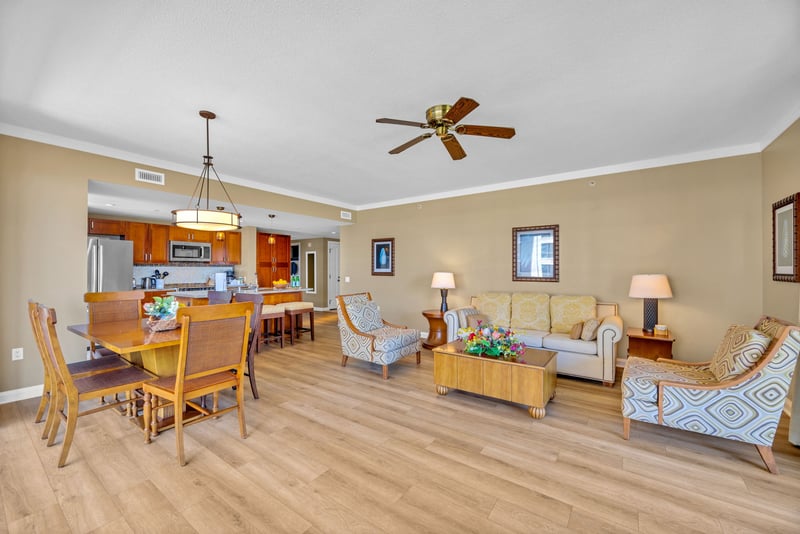 The bright open floor living space features comfortable furnishings
