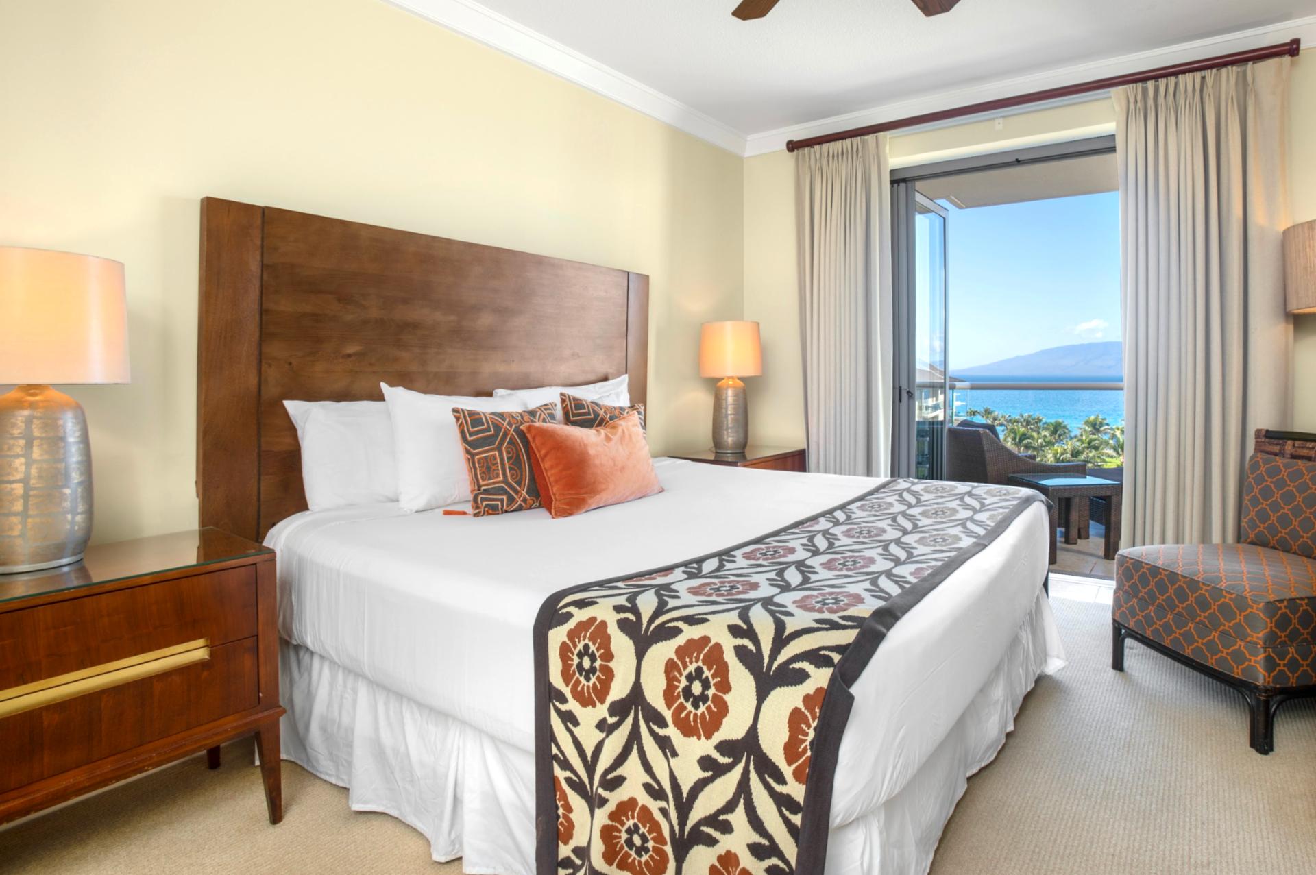 Sleep easy in this plush king bed with island-inspired flair and lanai access 