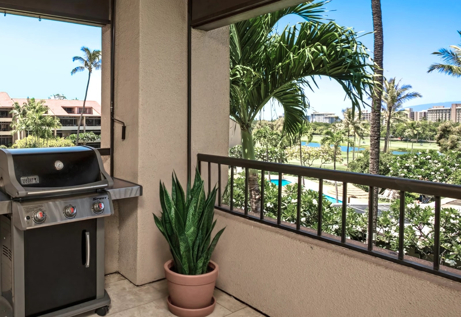 Grill and unwind with tropical views on your private lanai.