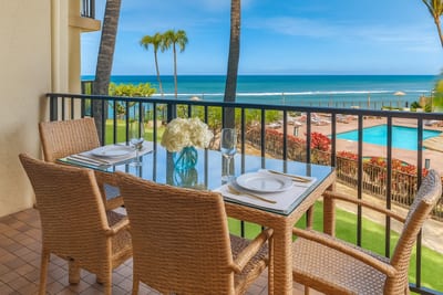 Unwind on this breezy lanai where island skies, swaying palms, and sunny moments frame every peaceful pause