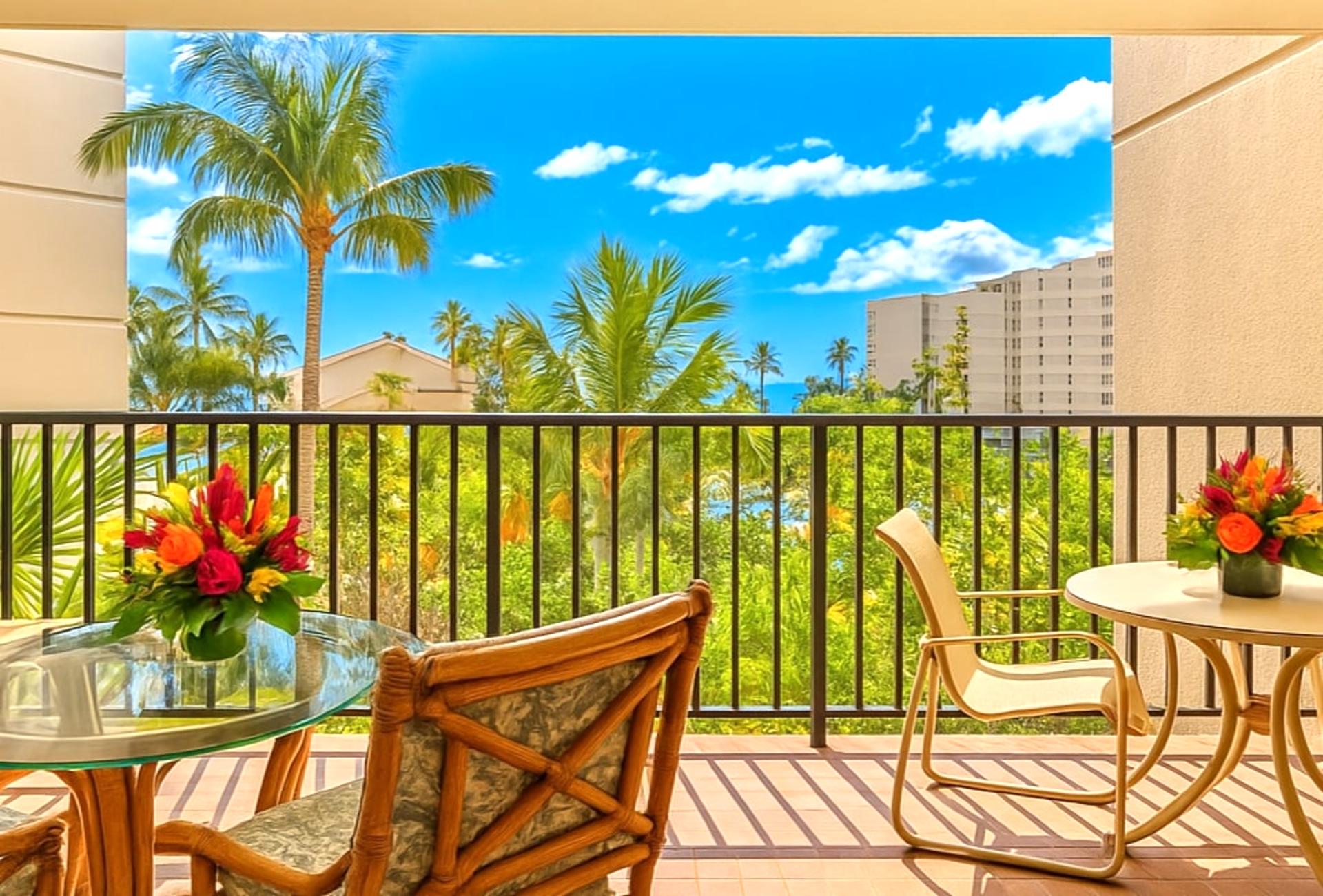 Unwind on this breezy lanai where island skies, swaying palms, and sunny moments frame every peaceful pause 