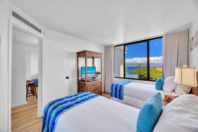 Tranquil guest room with views and soft island hues