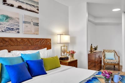 Bold bedding and personal touches offer a cozy escape