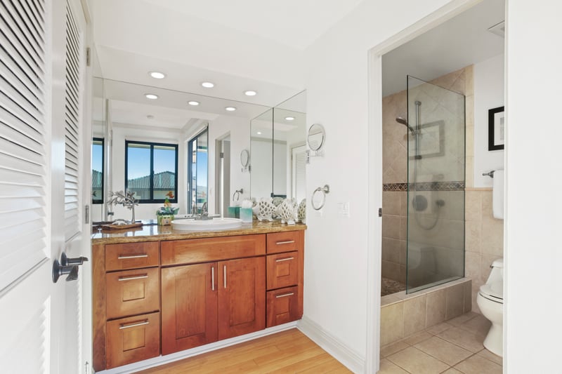 This sanctuary bath blends natural textures with thoughtful finishes, offering a serene space to refresh and restore