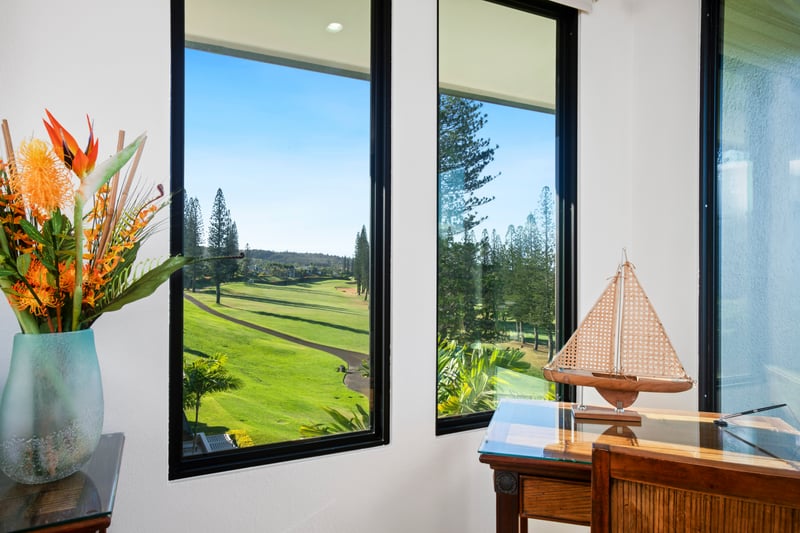 Gaze out at the rolling greens and golden light from this sun-kissed corner—where tropical charm meets quiet inspiration