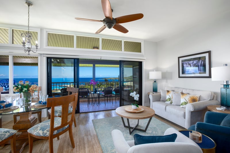 Framed by cathedral ceilings and kissed by island light, this living room stretches out like a deep, contented breath