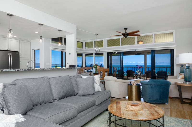 Ceiling fans stir slow secrets overhead while the tide-colored armchairs wait with stories to share and backs to rest
