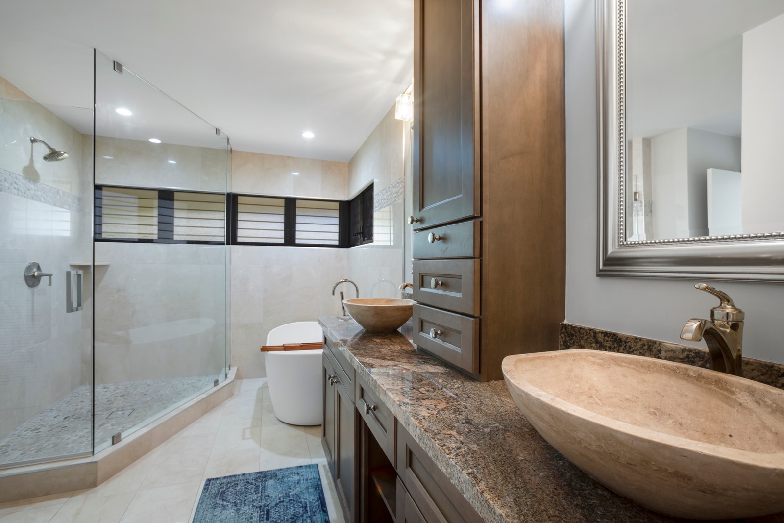 Why just bathe when you can bask? With sunlight streaming through louvered windows, it’s always golden hour here