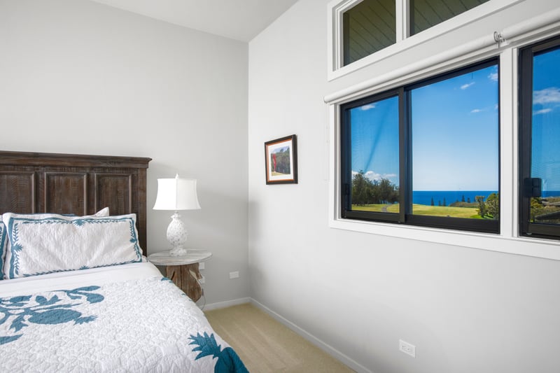 Mornings sparkle with Pacific blues, and nights glow with starlight — this master bedroom feels like a secret sky lounge