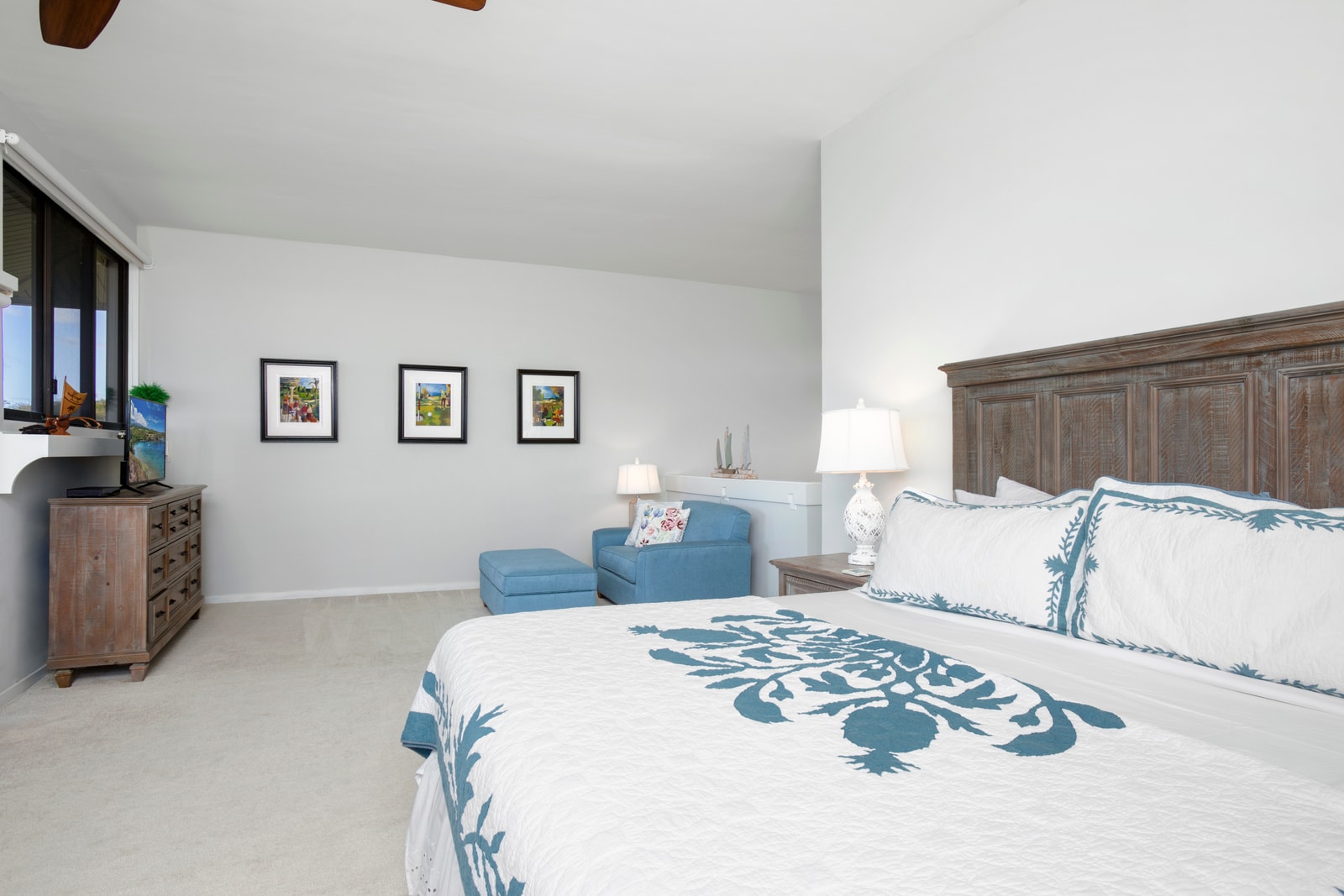 The spacious master bedroom offers a sitting room and ocean views