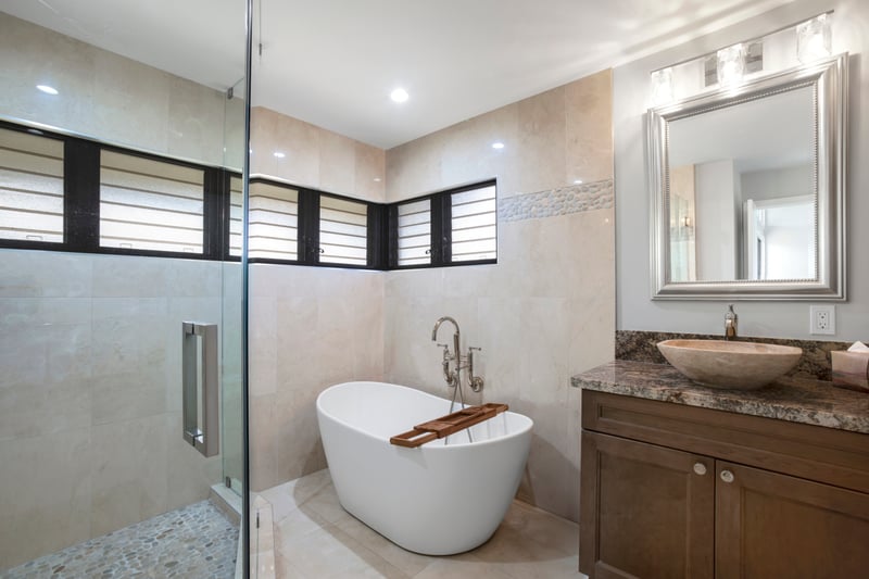 Soak like royalty in your freestanding tub throne, complete with a wooden caddy for bubbles, books, or bubbly