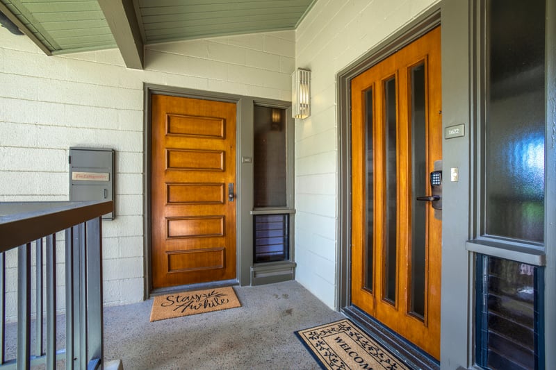 With thoughtful details and a secure keyless entry, this warm wood-toned doorway sets the tone for your stay
