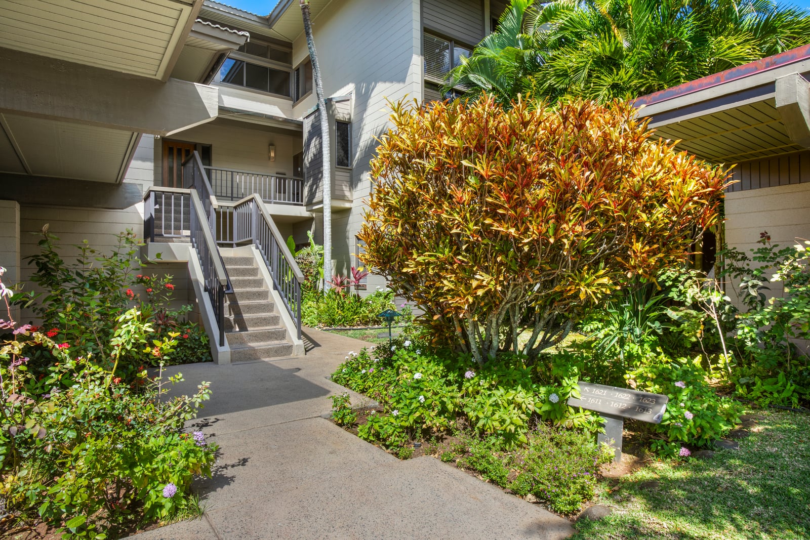 Surrounded by vibrant greenery and swaying palms, this private path leads you to your peaceful island sanctuary