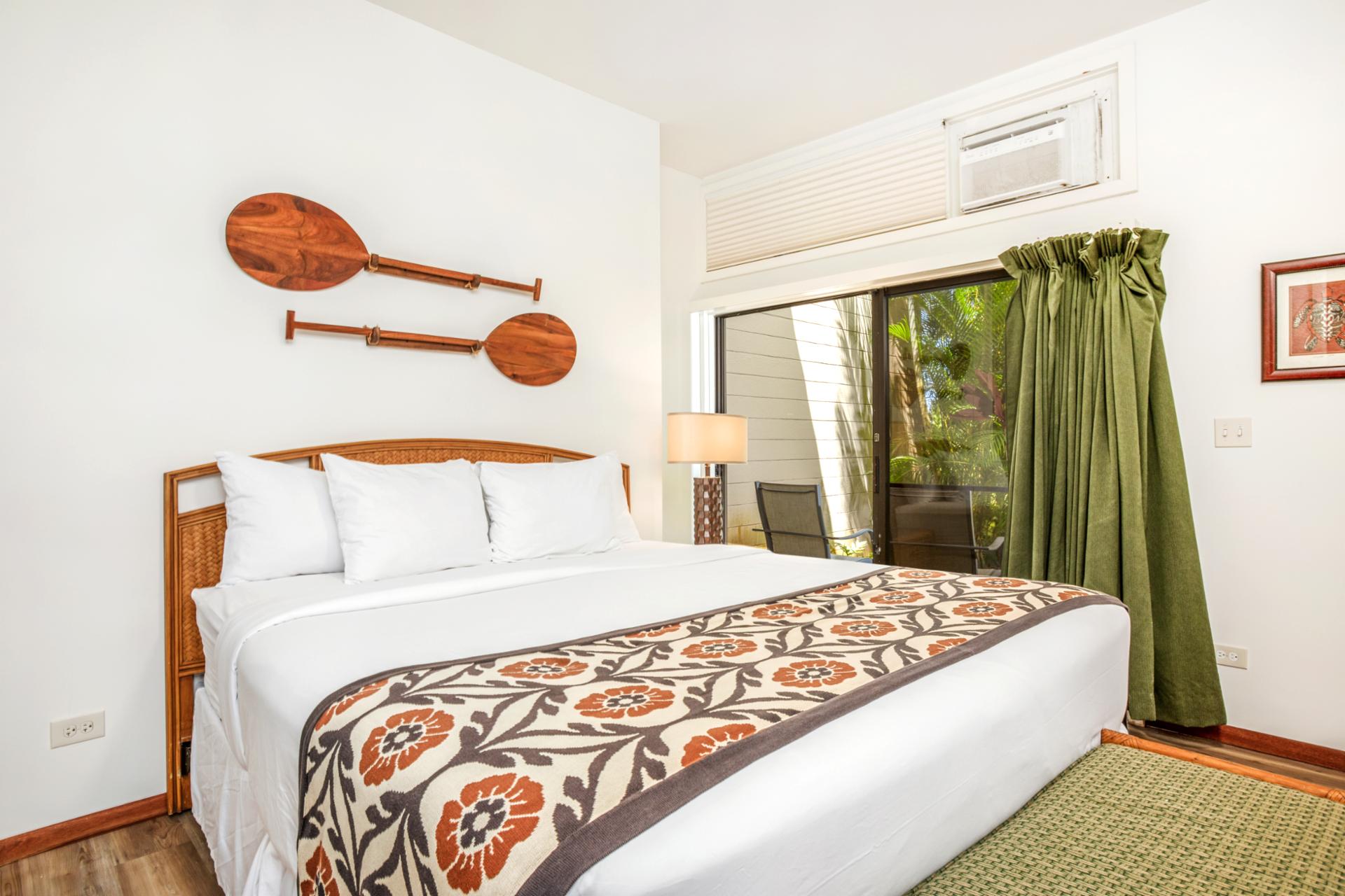 Slide open the doors and step into paradise—your cozy bedroom flows into your private lanai in the garden sanctuary