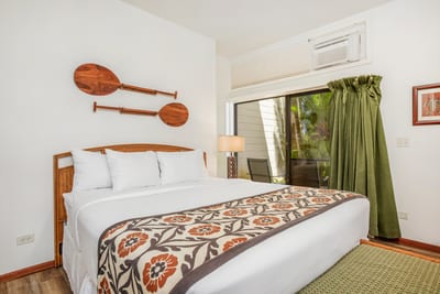 Slide open the doors and step into paradise—your cozy bedroom flows into your private lanai in the garden sanctuary KRV-514