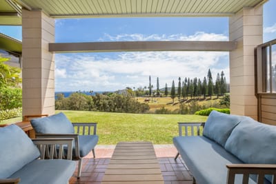 Covered balcony with plush seating and sweeping ocean view KRV-514