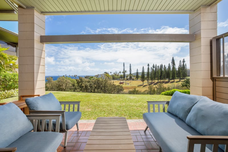 Covered balcony with plush seating and sweeping ocean view KRV-514