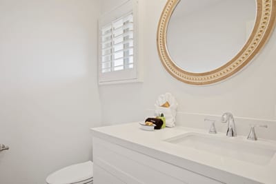 A soft symphony of white and ivory tones creates a refreshing haven, where every detail is as calming as it is refined