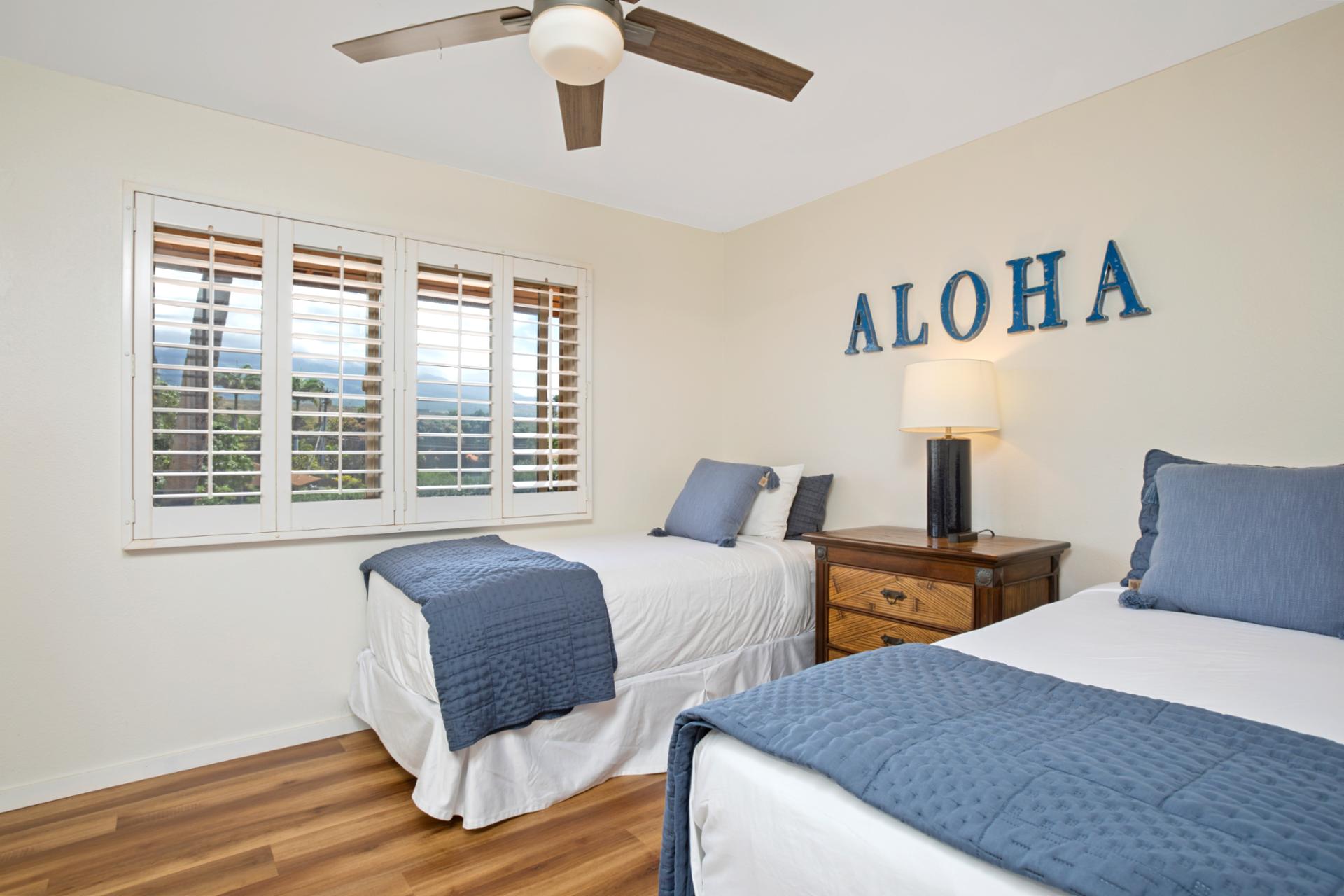 Clean lines, cool tones, and a splash of aloha—this twin retreat brings island joy to every restful night.   