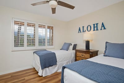 Clean lines, cool tones, and a splash of aloha—this twin retreat brings island joy to every restful night.