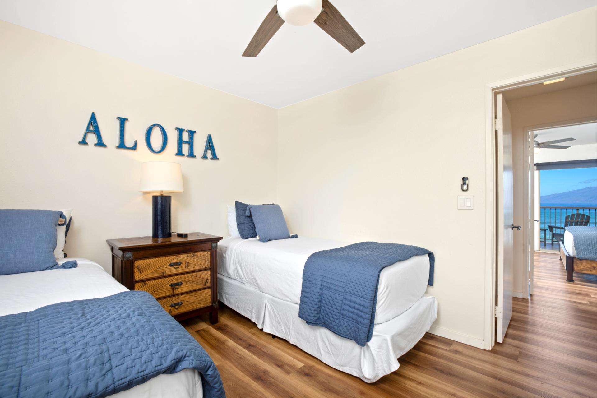 Say “Aloha” to restful charm—twin beds, ocean blues, and sunny vibes come together in this cozy island escape   
