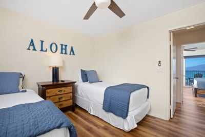Say “Aloha” to restful charm—twin beds, ocean blues, and sunny vibes come together in this cozy island escape