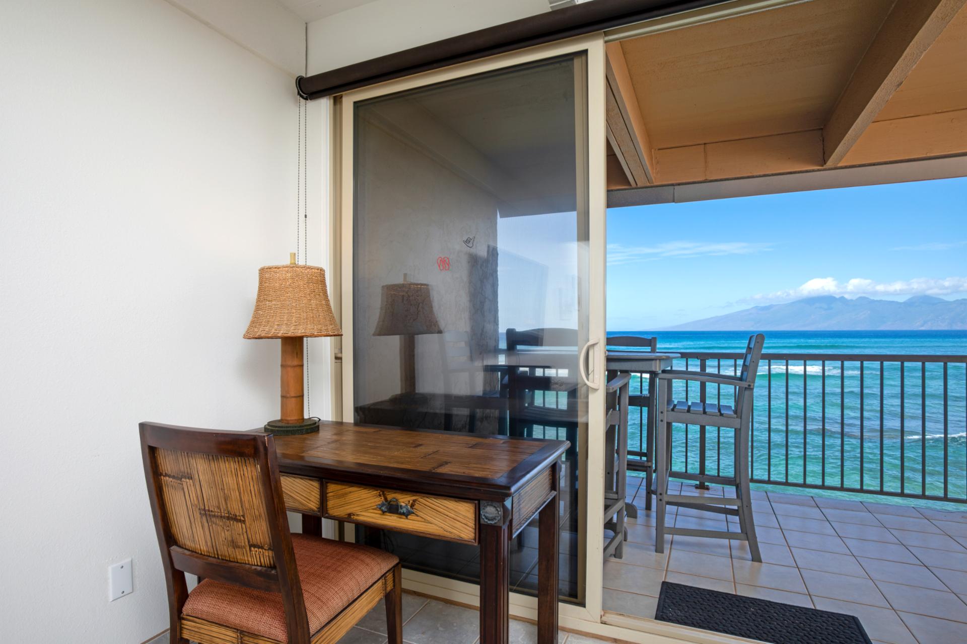 This serene writing nook pairs handcrafted island charm with an inspiring view—where thoughts drift as easily as the waves beyond   