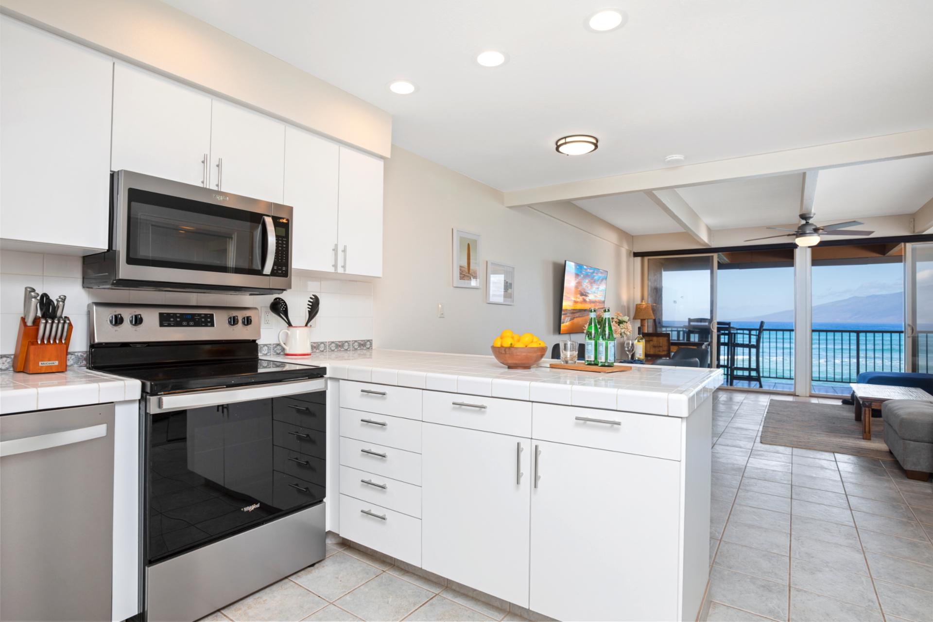Crisp white cabinets and breezy light make this kitchen feel like a cloud where recipes float and flavors sing   