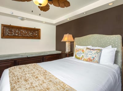 A palm-leaf ceiling fan swirls gentle breezes above the queen bed, like nature itself waving you to sleep MAH-301