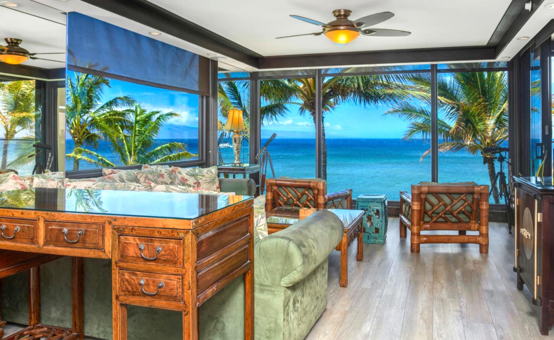 Where the ceiling fans hum tropical lullabies and every window is a painting only nature could compose