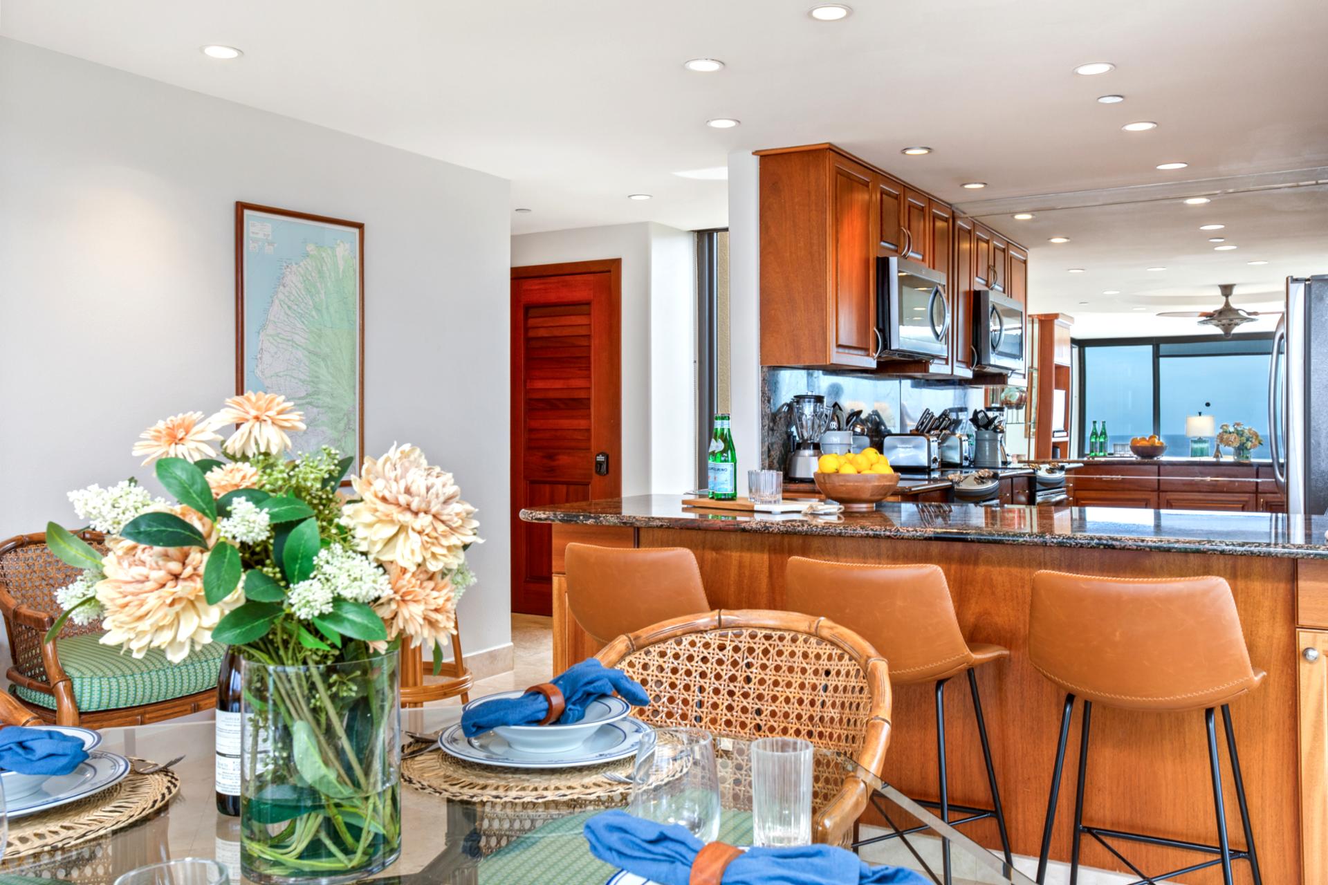 The open floor plan allows you to catch up with friends at the bar while you whip up a meal