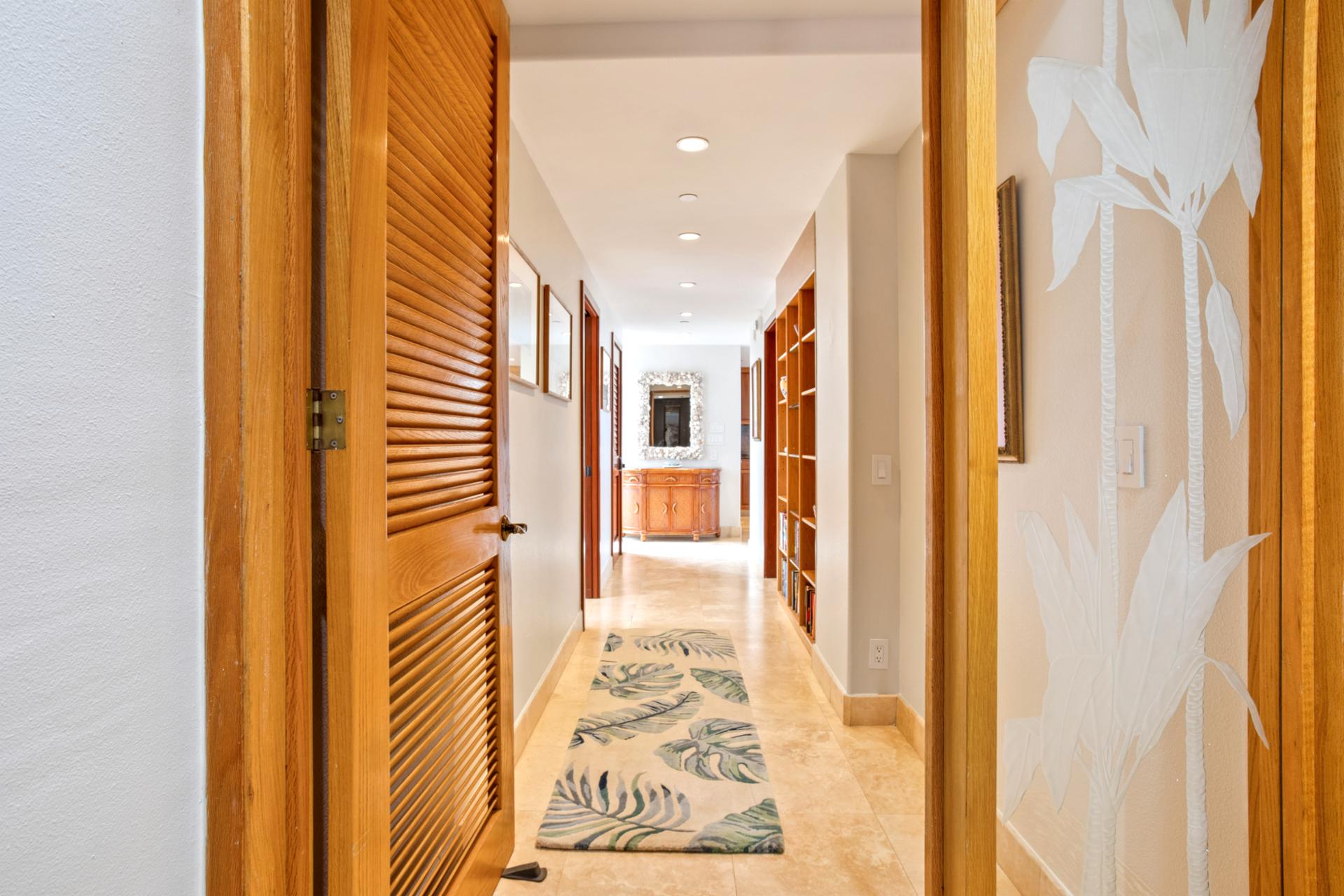 Be welcomed by a hallway of tropical elegance and warm island decor