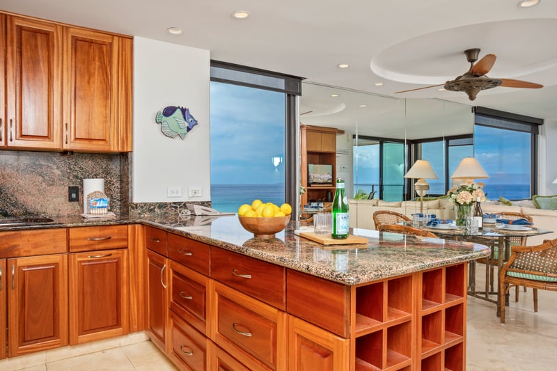 Cook with a view in this gourmet kitchen featuring island seating and ocean backdrop MAH-719