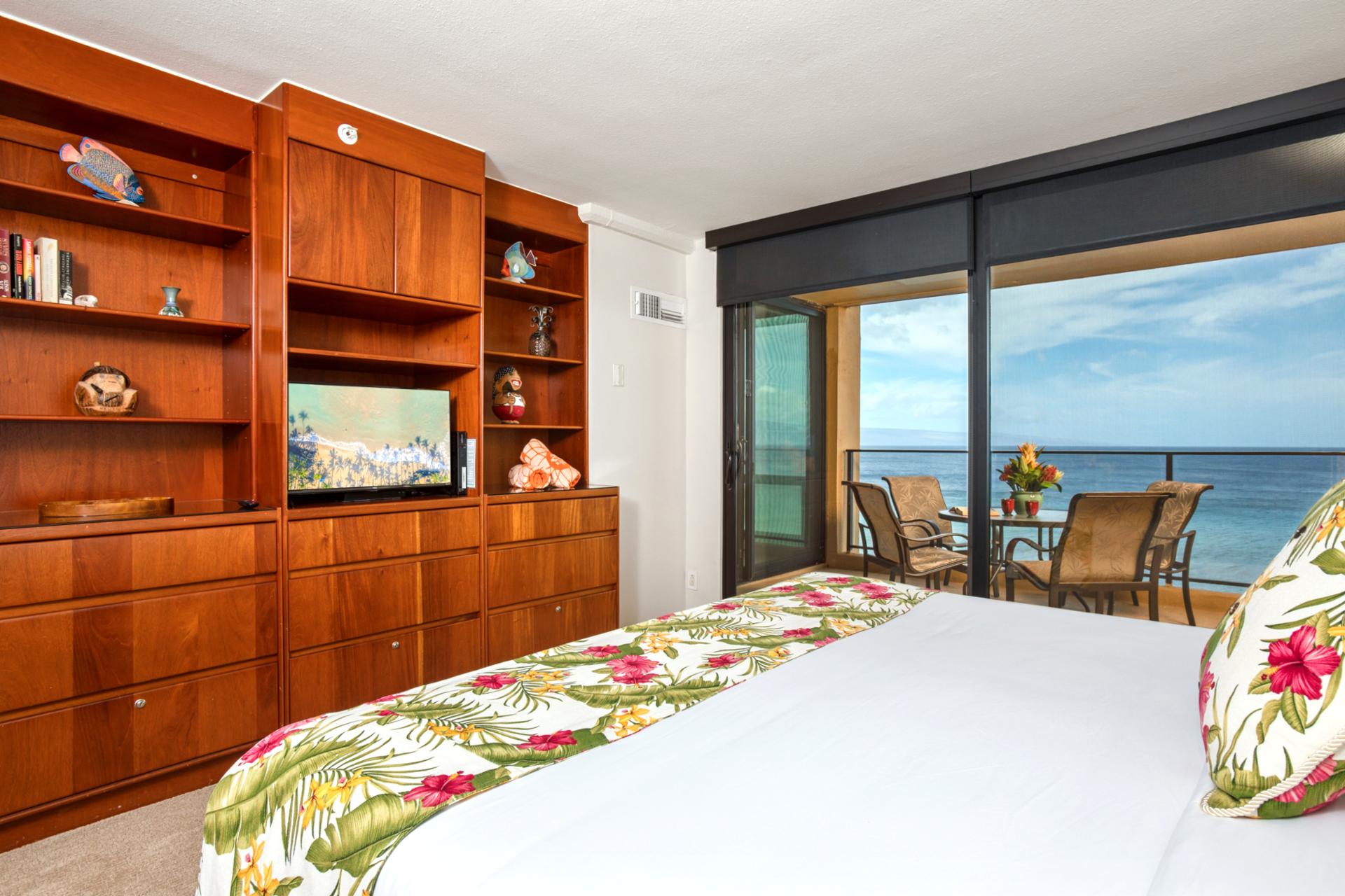 Unwind in a warm, wood-accented master suite with soothing island tones