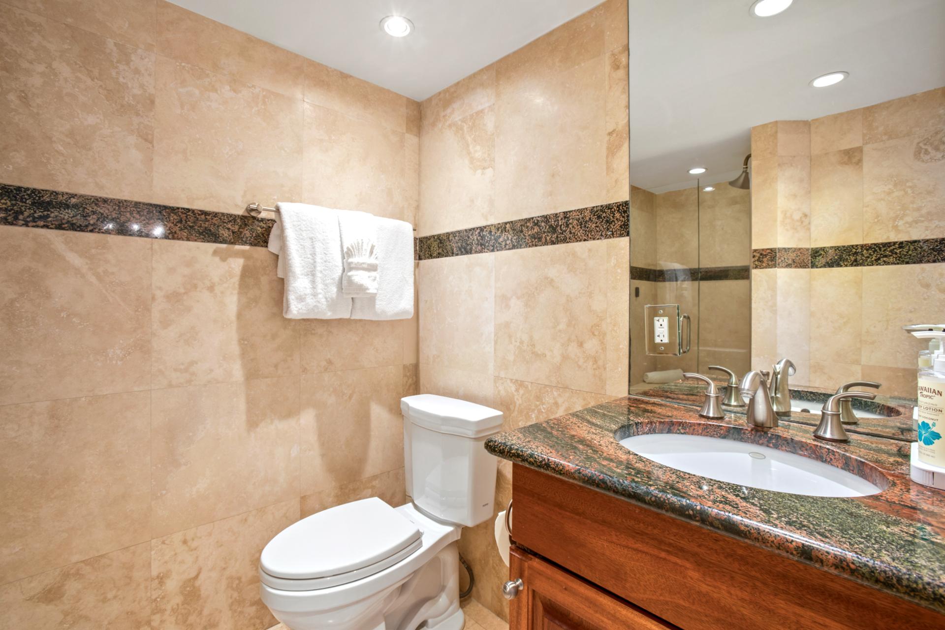 The master bath features a separate shower and toilet area for additional privacy