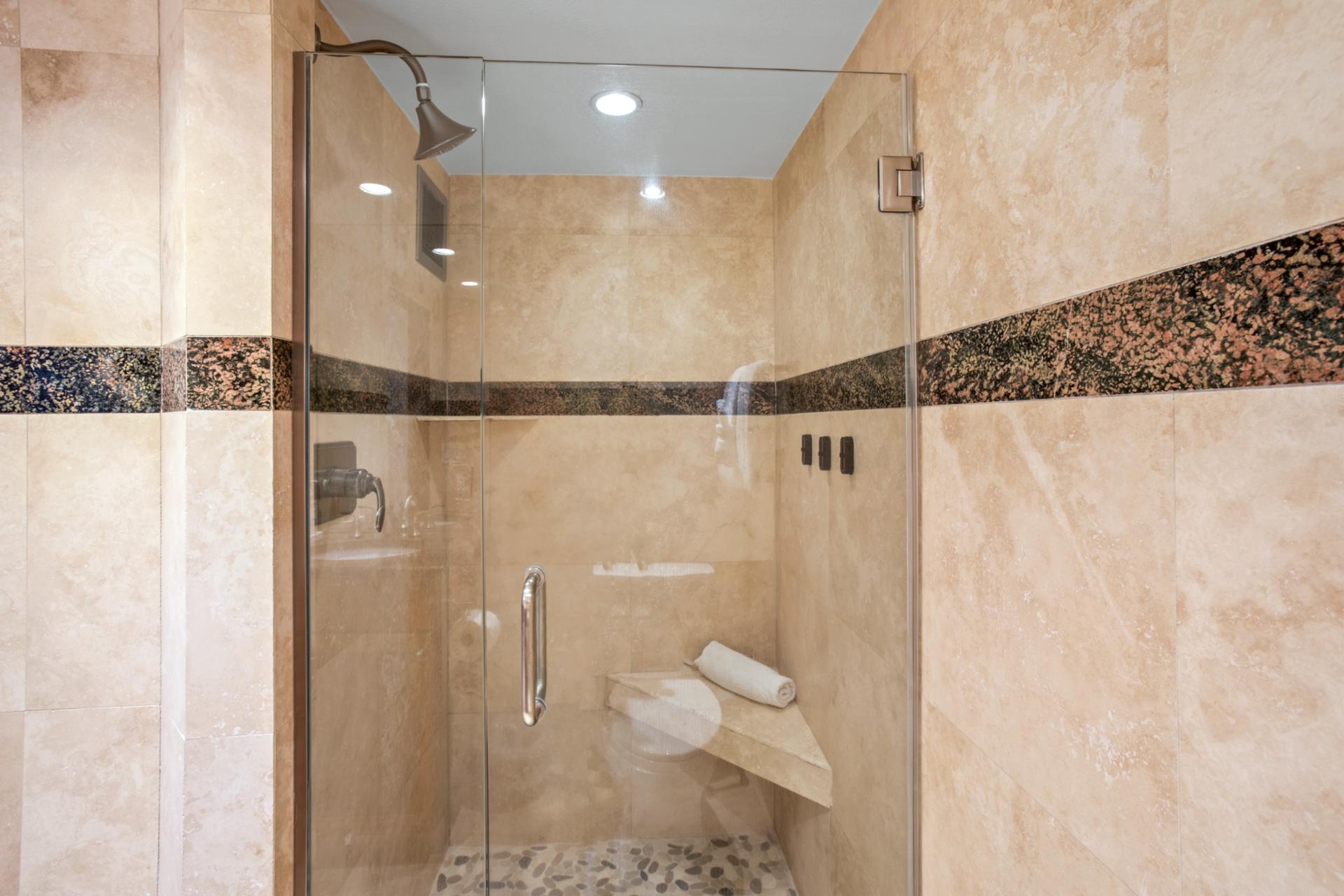 Luxuriate in a tiled walk-in shower after a day in the sun
