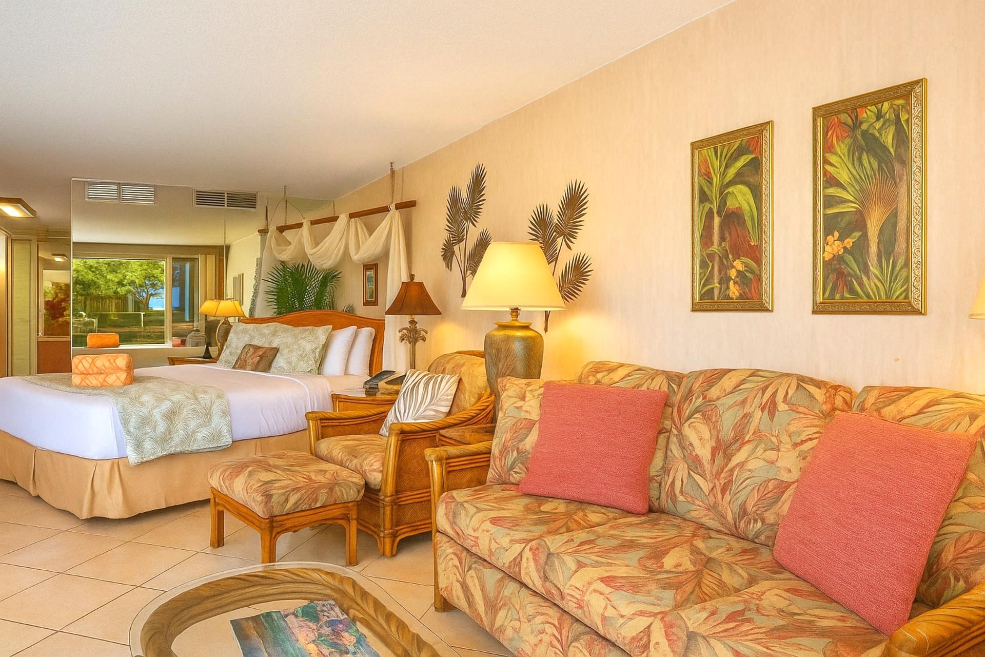 Surrounded by woven wood, soft cushions, and a hint of ocean blue—this room whispers comfort in every corner