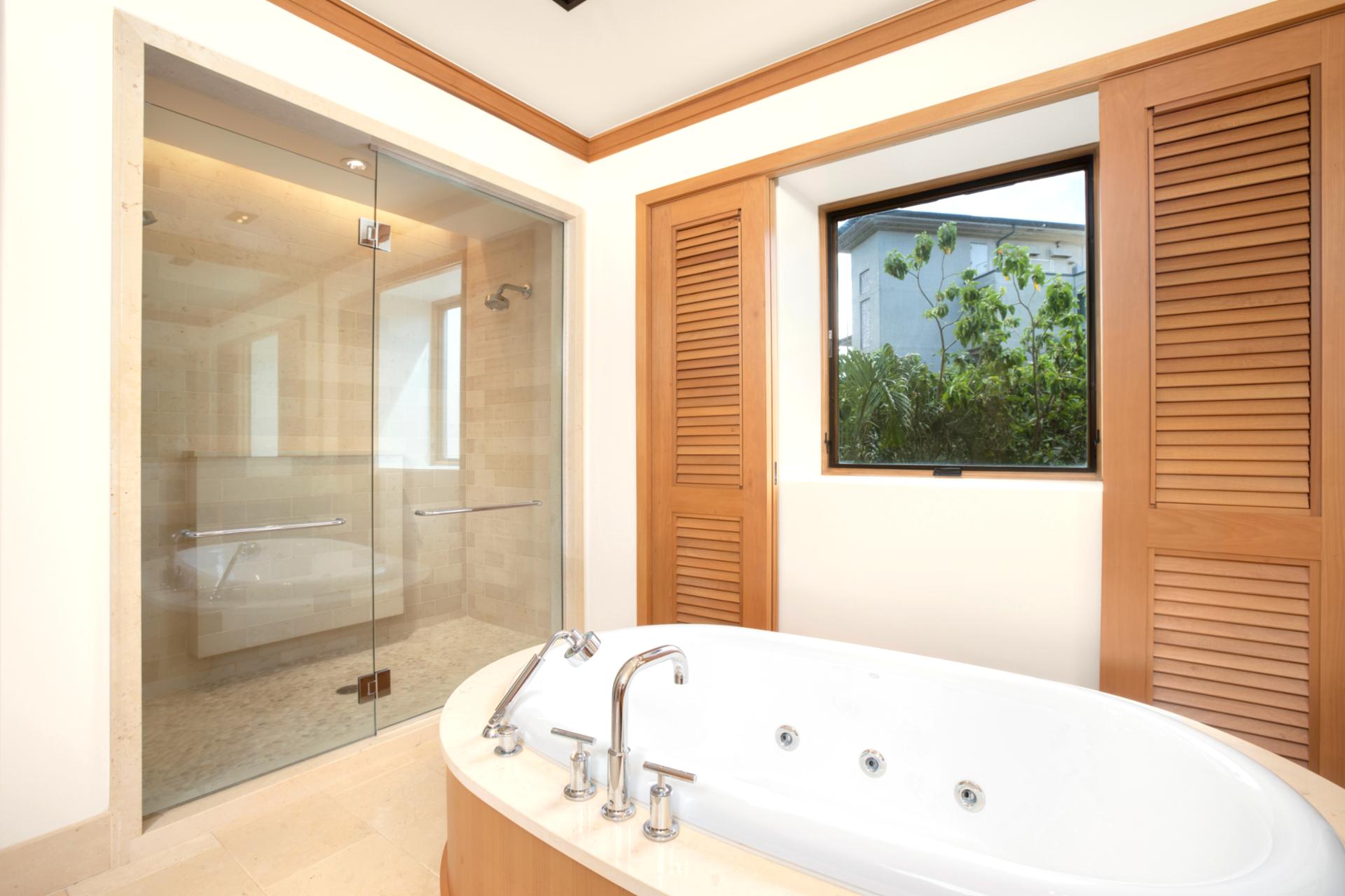 This oval tub isn’t just a bath—it’s a floating island of calm, complete with leaf-framed views and jetstream bliss   