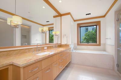 The double vanity practically curtsies with charm, offering space for morning grace and evening ritual