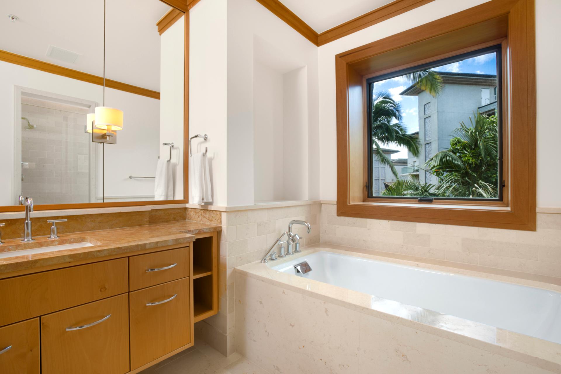 Gleaming chrome fixtures sing in harmony with warm cabinetry—practical, posh, and perfectly peaceful   